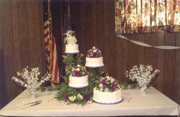 Description Picture of a wedding cake table and decorations