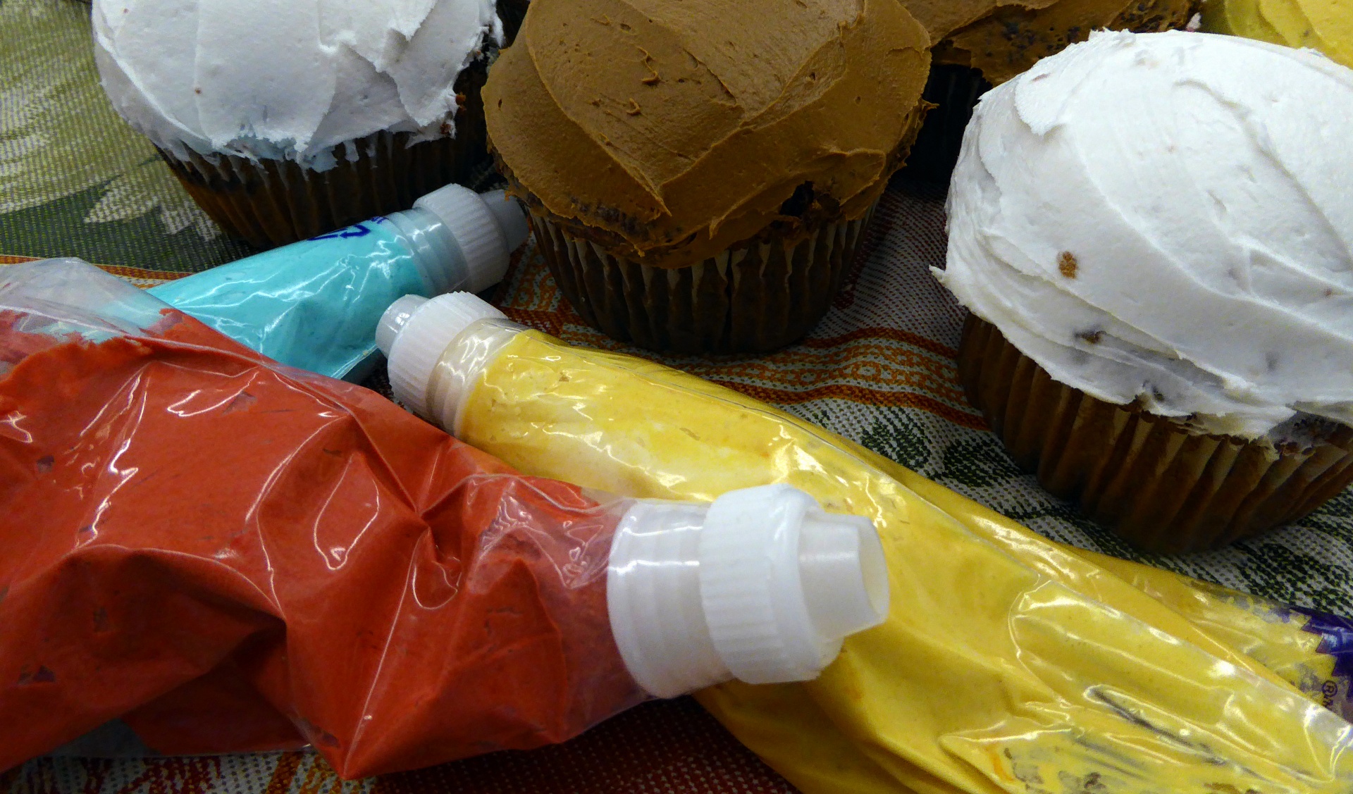 Cupcakes And Filled Pastry Tubes