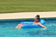 Woman On Pool Float