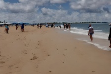 Beach And People Walking