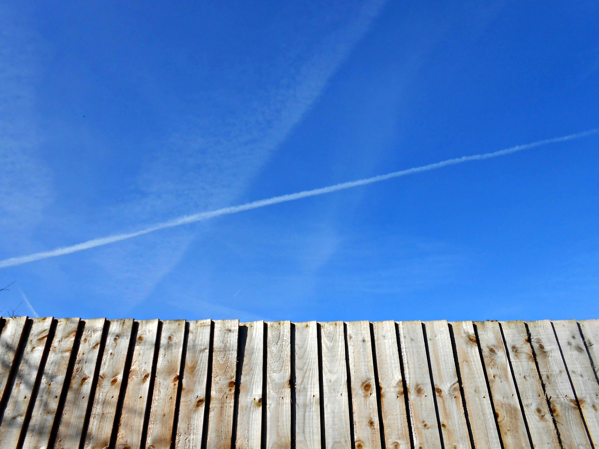 Blue Sky Contrasting Wooden Fence