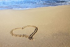Sand hjärta och ocean