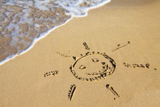 Slunce znak v písku