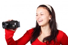 Woman holding video camera