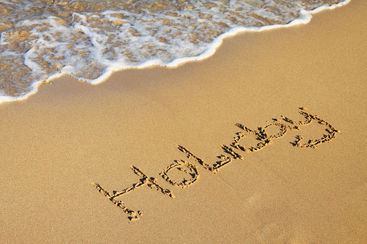 Slovo dovolená v písku