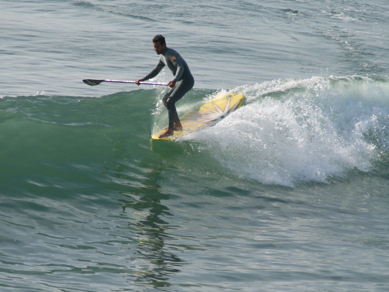 Paddleboard Surfer Hangs Five