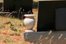 Ceramic flower pot on grave