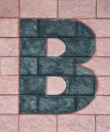 Letter B on brick wall