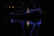 Lighted Boat Reflected In Water