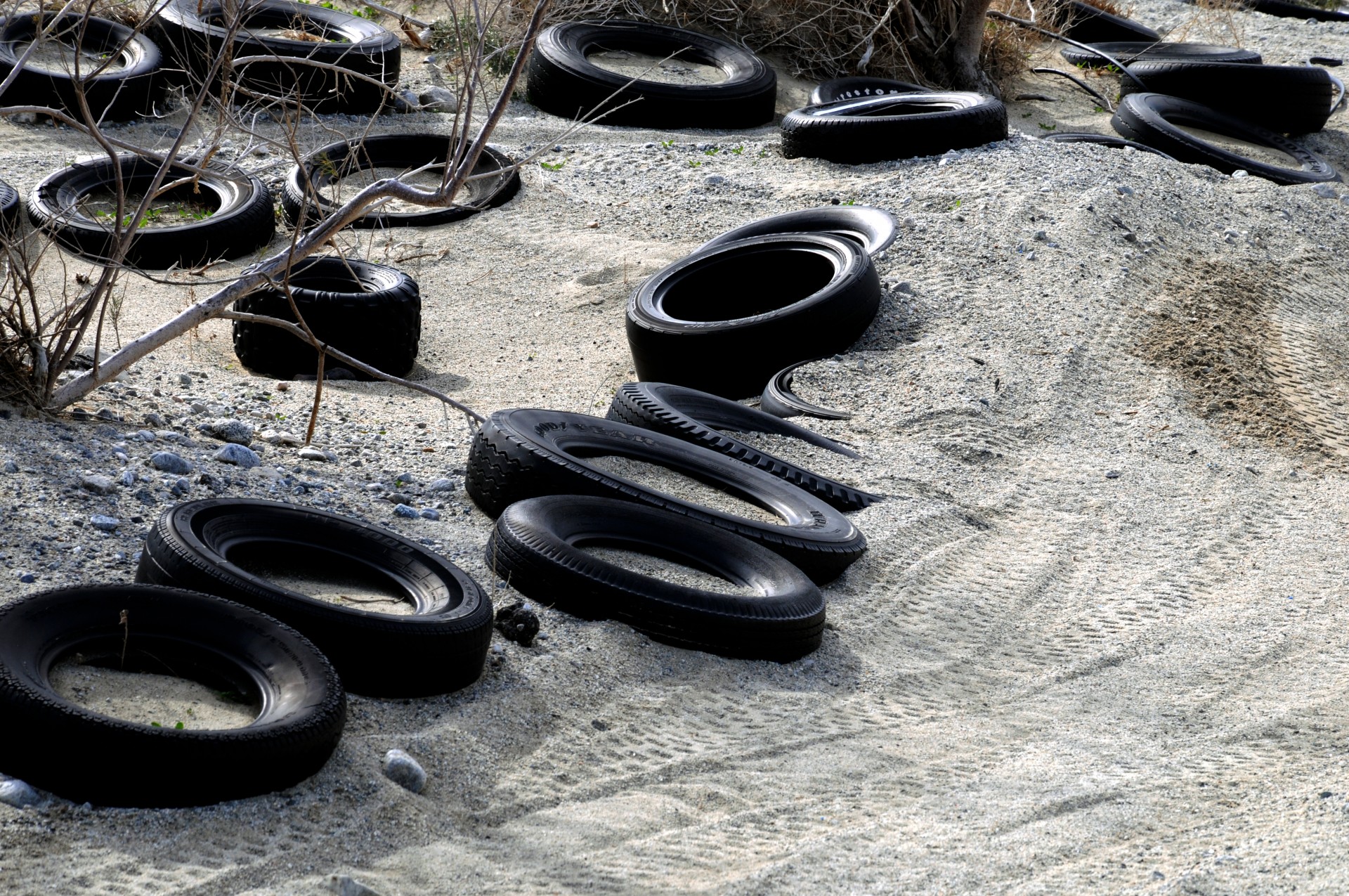 Black Tires In White Sand