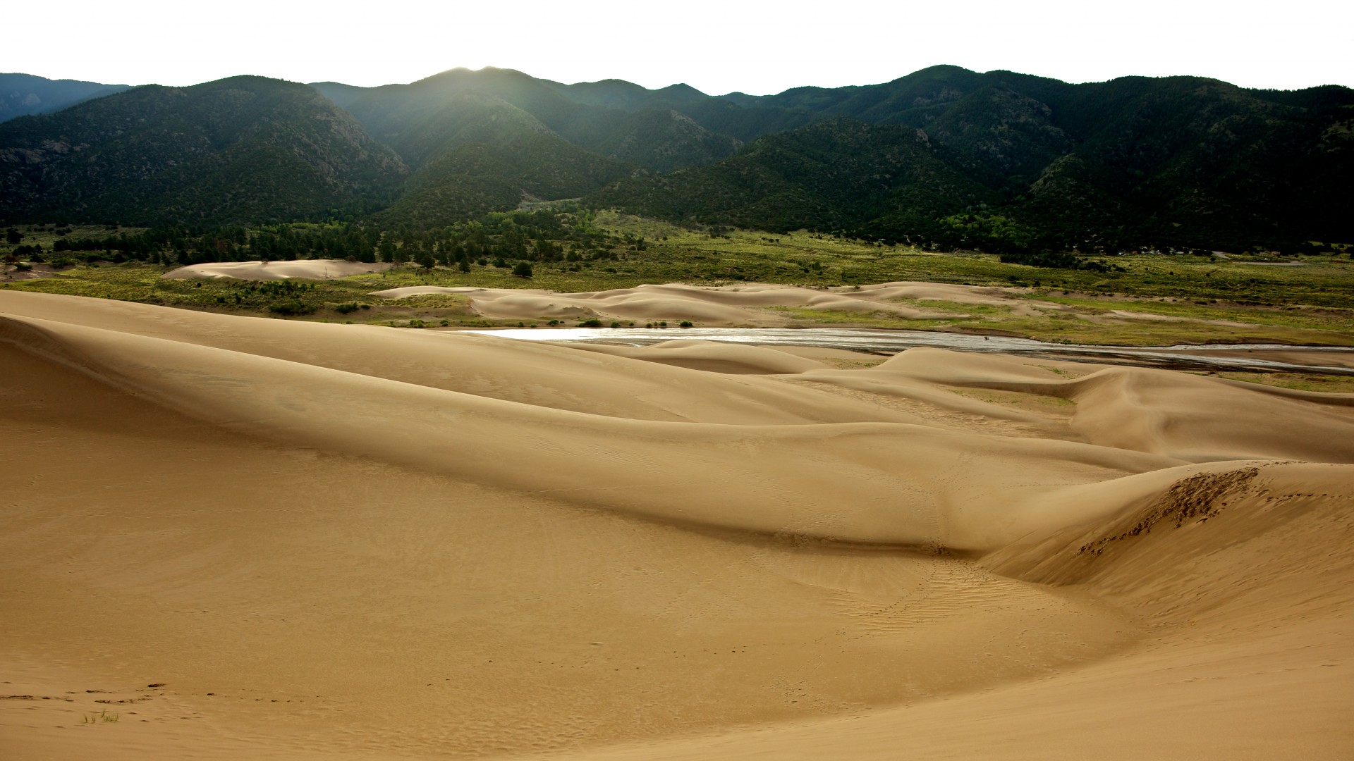Sand Dunes And Mountains