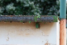 Flaking Gutter And Wall