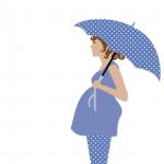 Donna incinta con l'ombrello