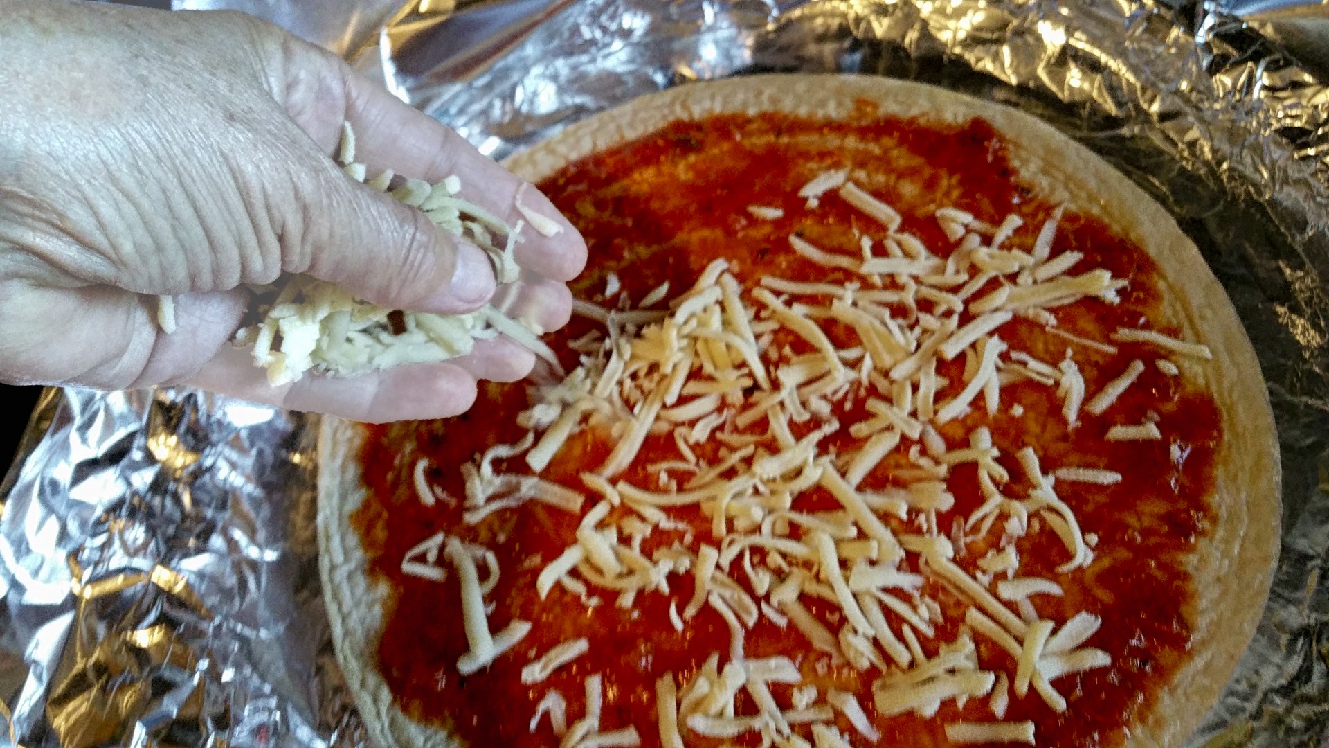 Adding Cheese To Homemade Pizza Free Stock Photo - Public Domain Pictures