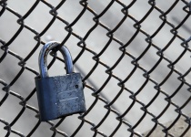 Padlock On Chain Link Fence
