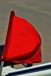 Point of flag tied to pole
