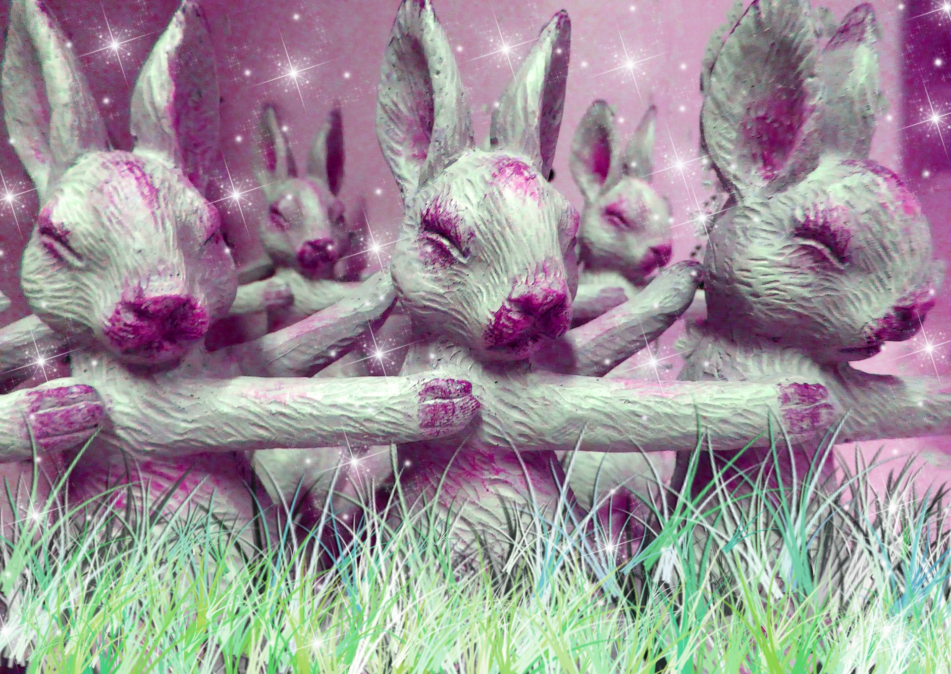 Los conejos de color rosa en la hierba