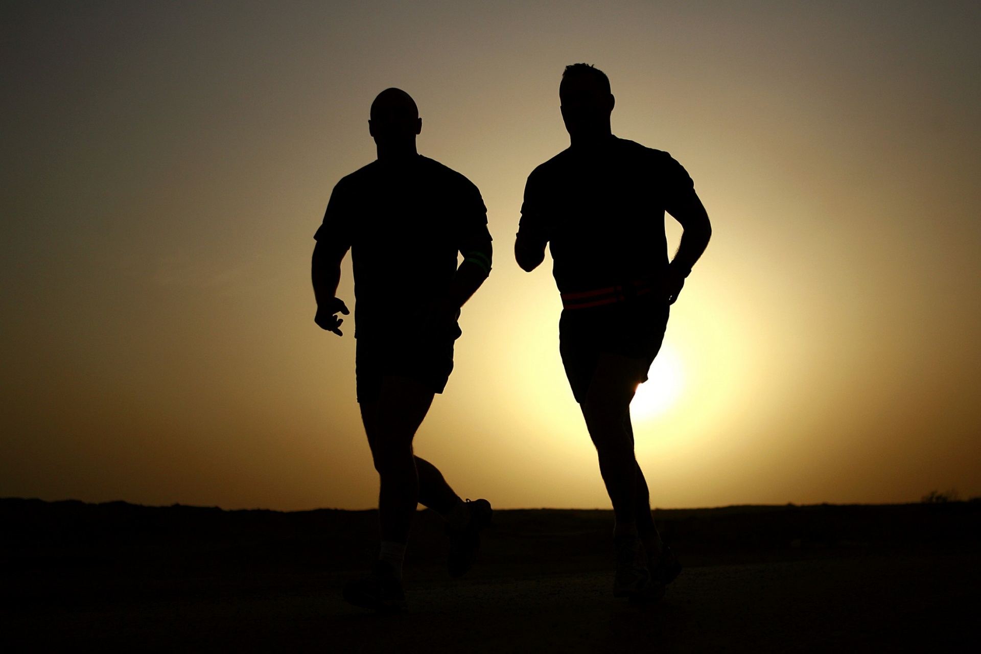 Runners Training At Sunset