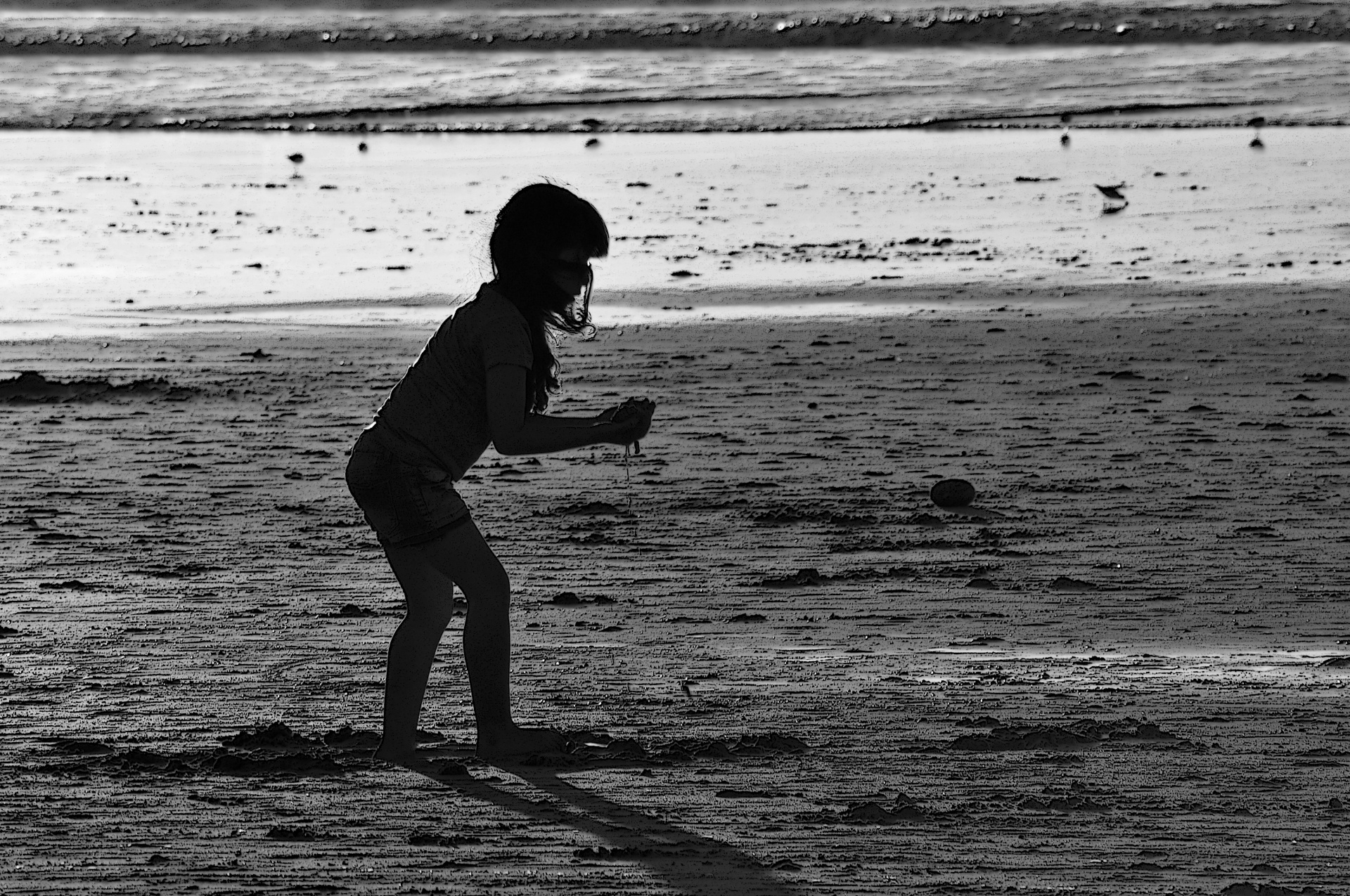 Silhouetted Child At Beach