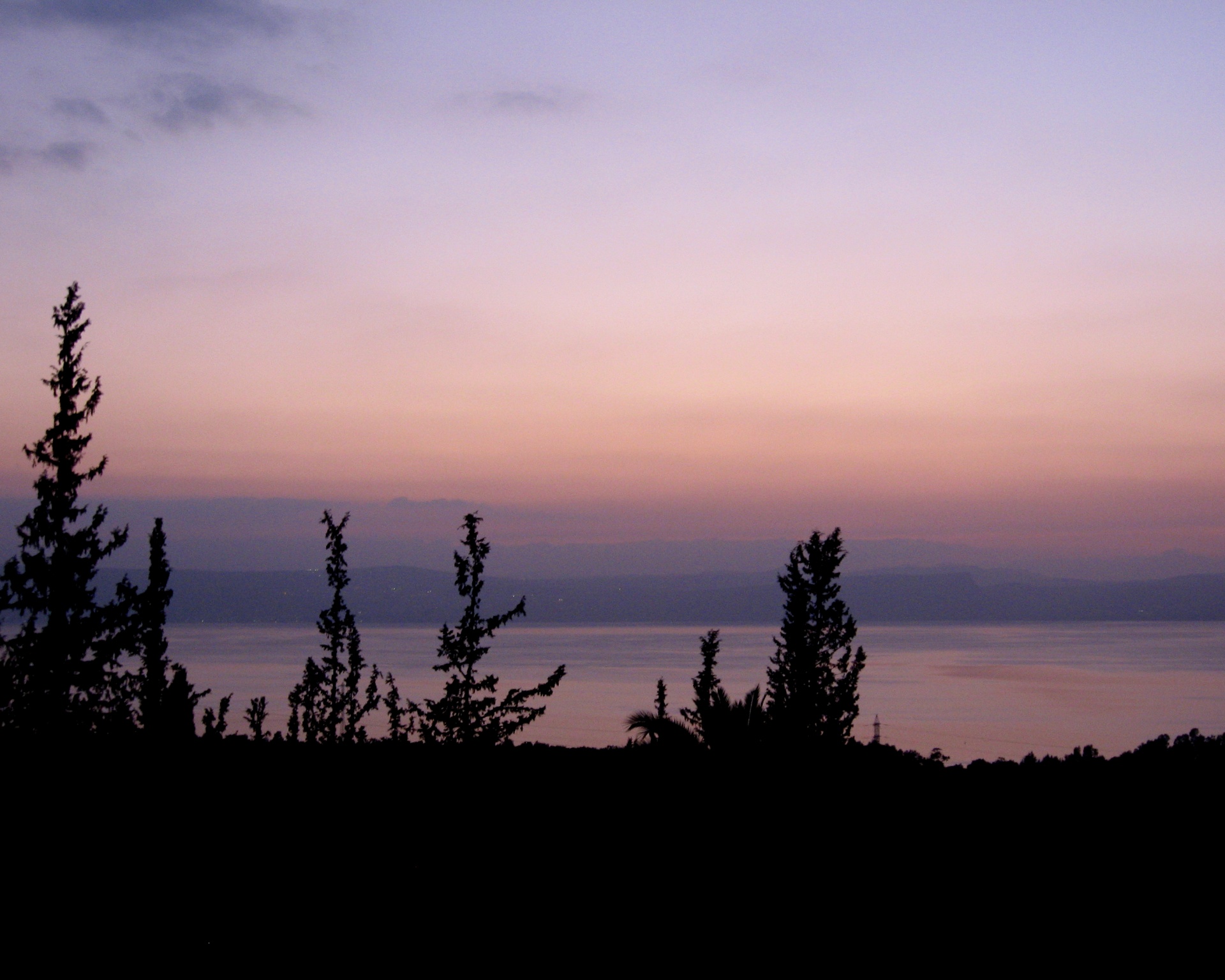 Mar la puesta del sol de Galilea