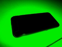 Mobiltelefon - grön bakgrund