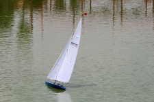 Model yacht tilted on the water