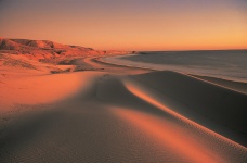 Puesta de sol en el océano de las dunas