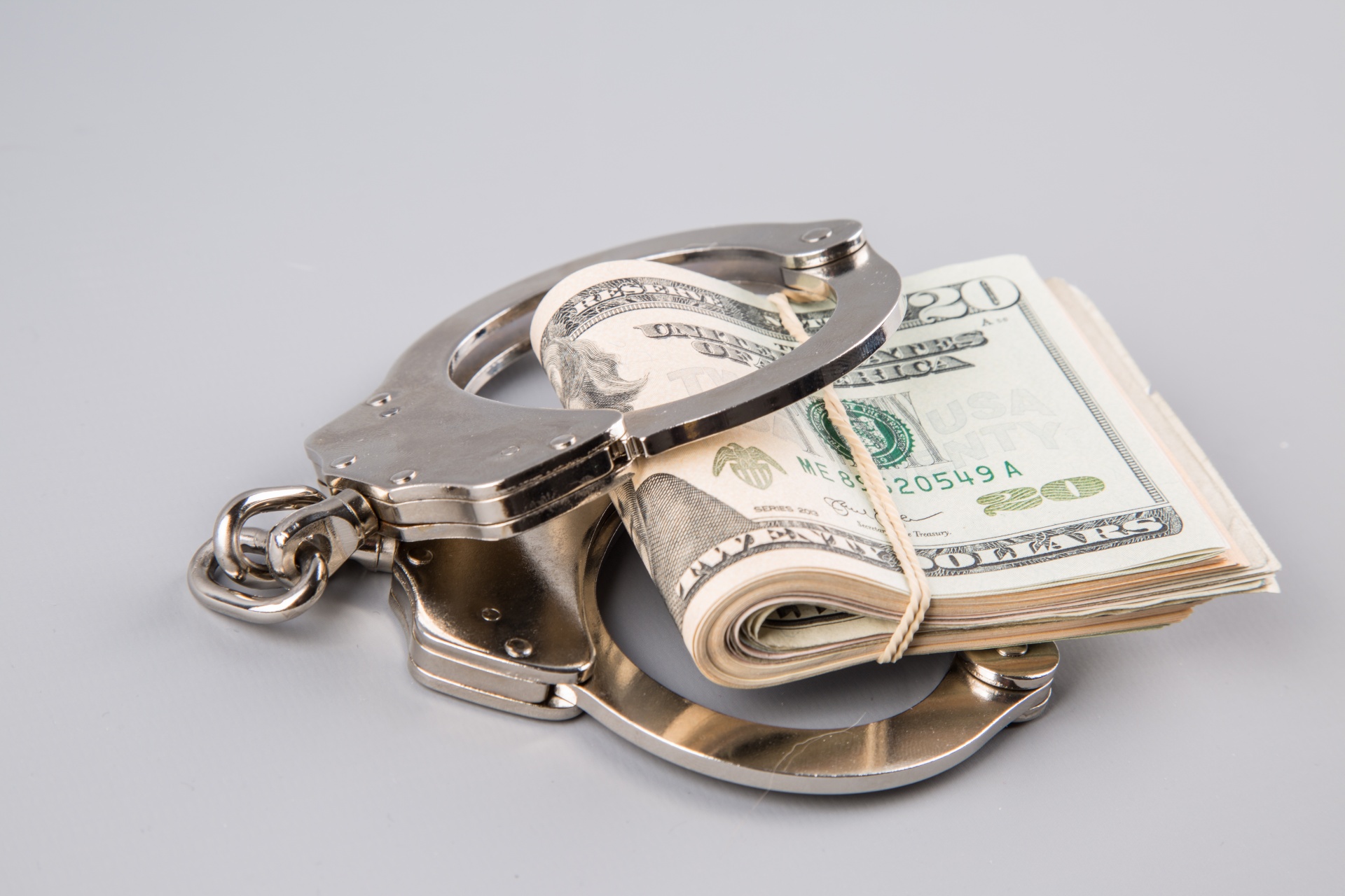 Handcuffs And Money Free Stock Photo - Public Domain Pictures