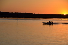 Boat returning at sunset