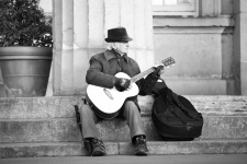 Street musician playing a guitar
