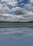 Reflection of clouds over dam