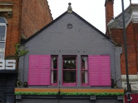 House With Pink Window Shutters