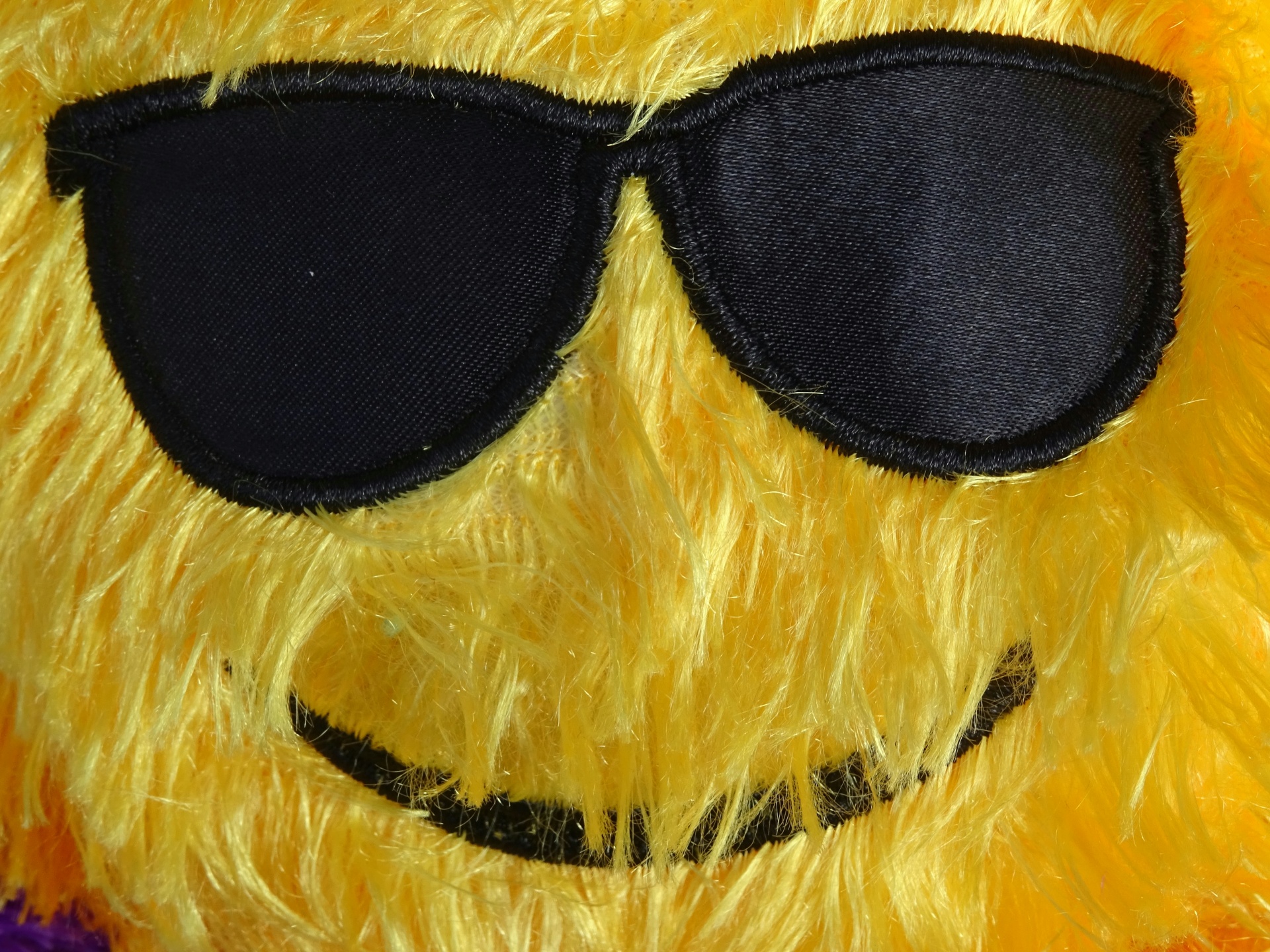 Toy Smiley Cuddly con occhiali da sole