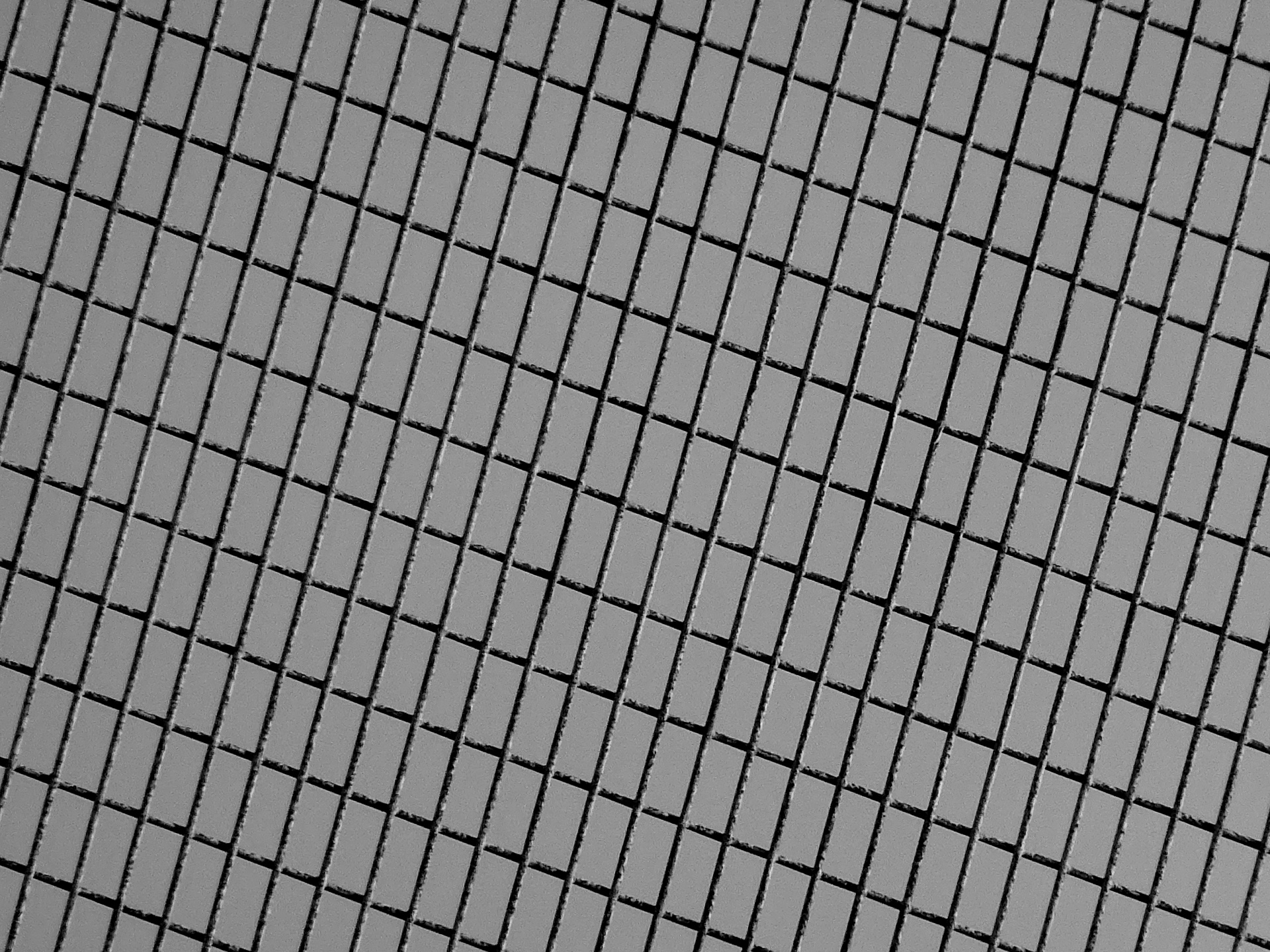 Sfondo grigio modello della rete metalli