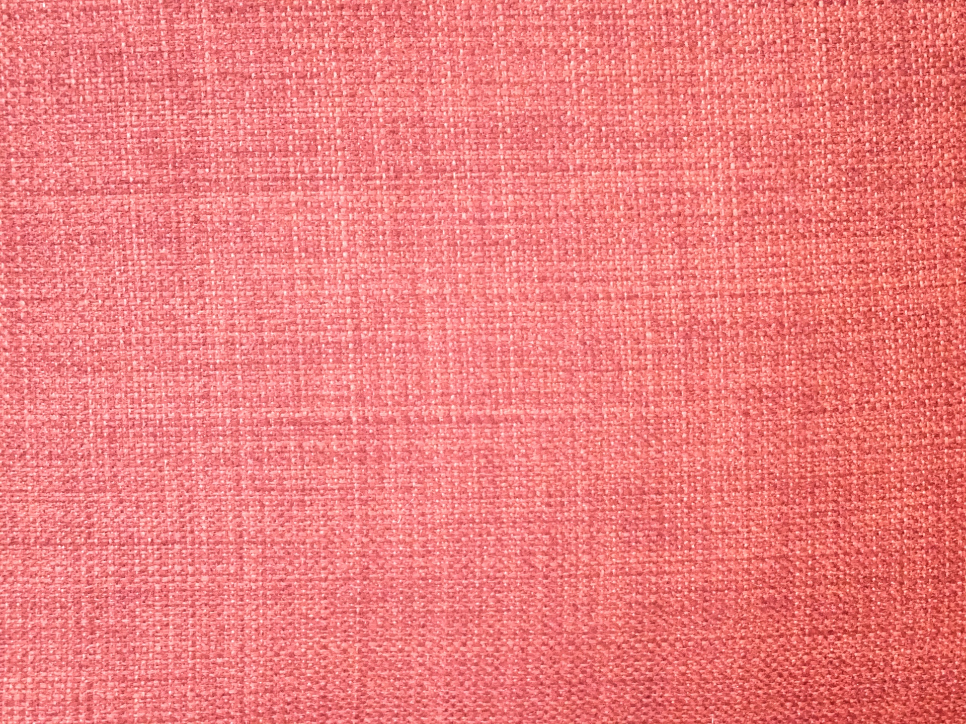 Fondo rosado de la tela con textura