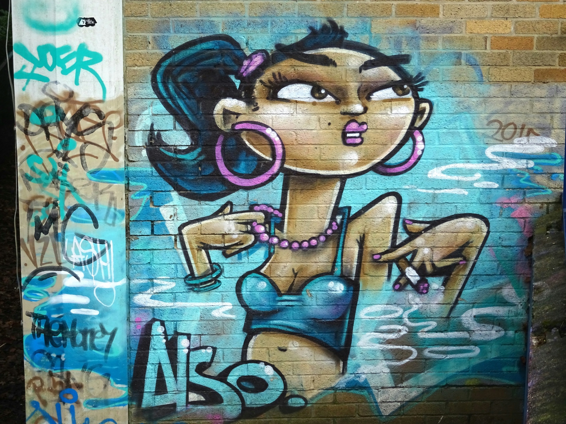 Street Art Graffiti auf Backsteinmauer