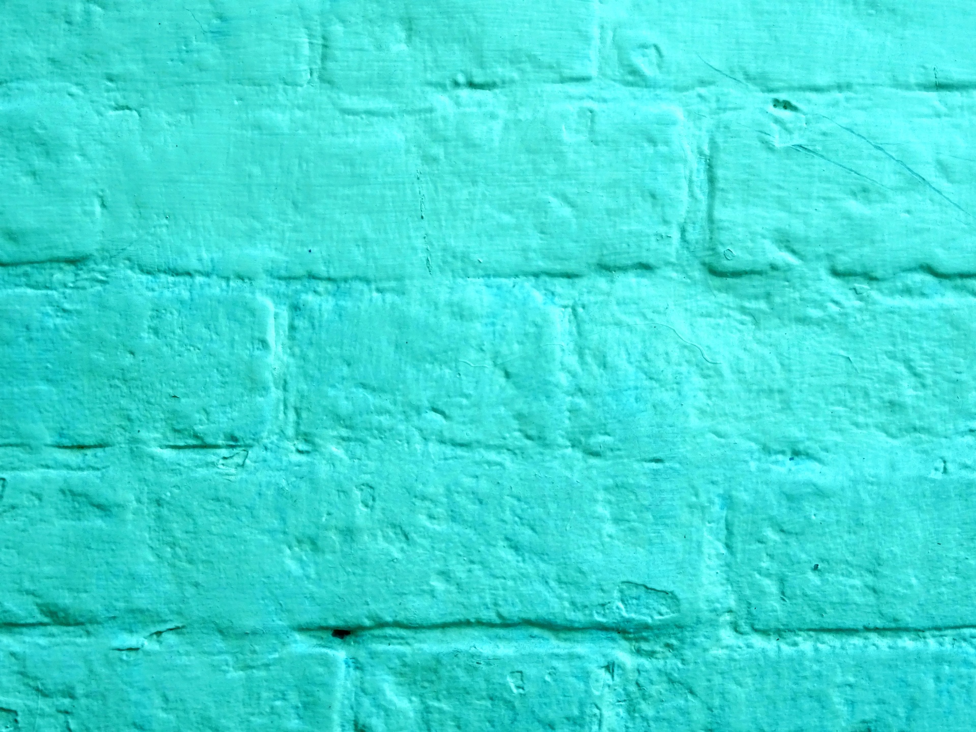 Turchese dipinto muro di mattoni