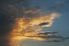 Fiery flecks in cloud at sunset