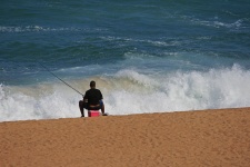 Fisherman beside the sea