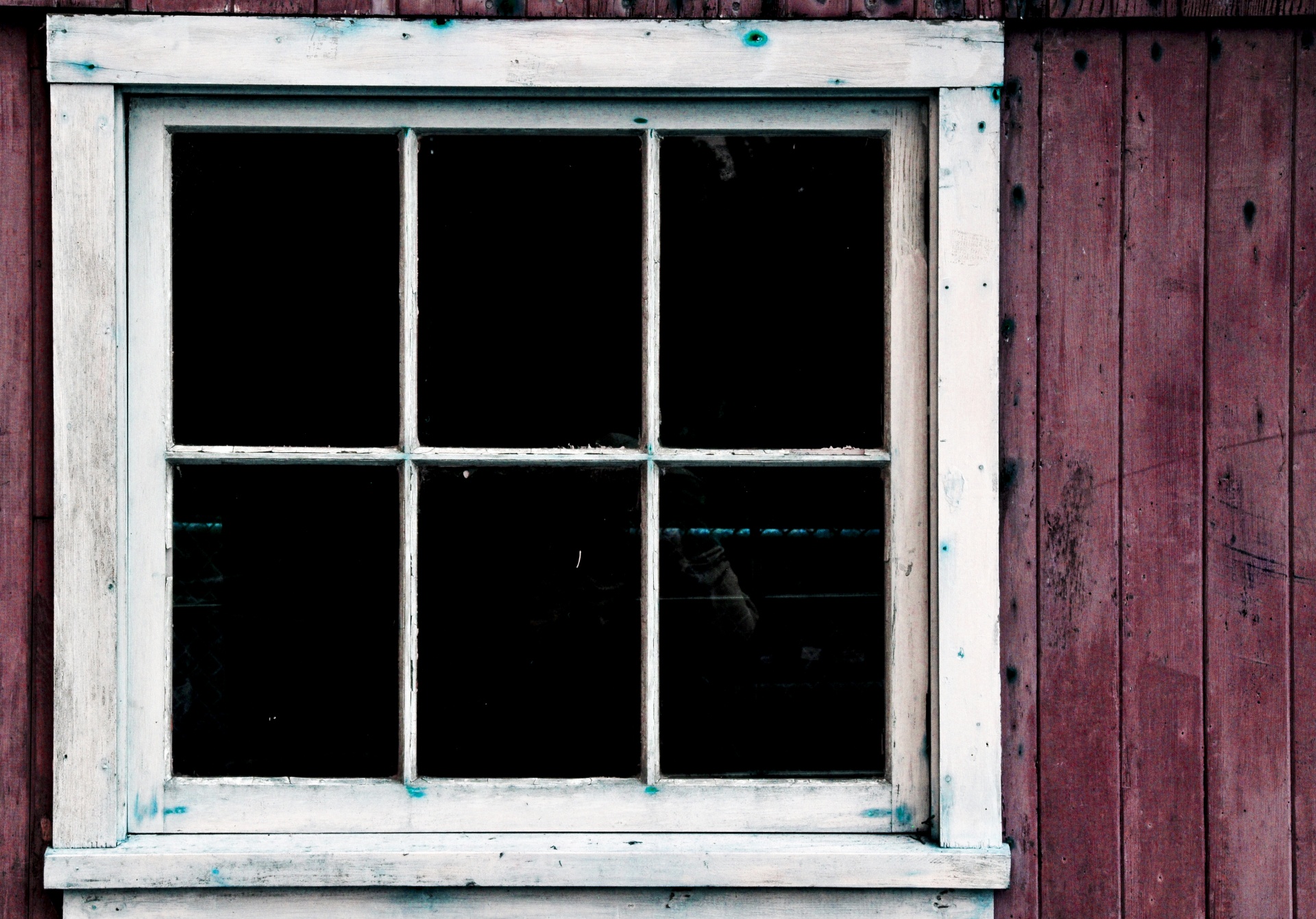 A weathered shed window