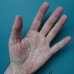 Hand On Blue Background