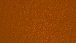 オレンジ色の漆喰壁