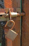 A padlock hanging on sliding bolt