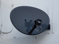 Black Satellite Dish On Building