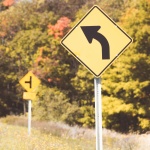 Curved Arrow Road Sign