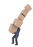 Man Carrying Stack of Boxes