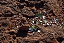 Broken Glass On Red Earth