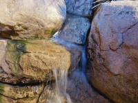 Water Flowing From Boulders