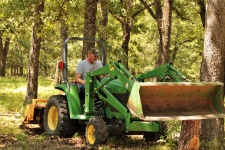 Senior Man Using Tractor