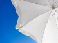 White umbrella and blue sky